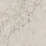 White and gray marble surface featuring natural, irregular veining patterns.