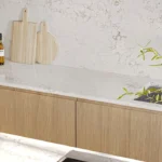 Caesarstone ICON 5105 Calacatta Dreamwave white veined surface in modern farmhouse kitchen